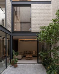 an open living room and dining area in a modern house with large windows on the side