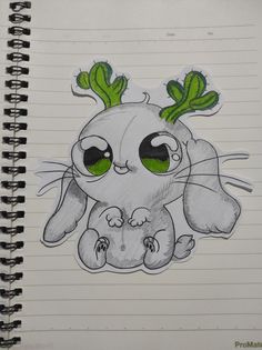 a drawing of a rabbit with green eyes and some leaves on its head, sitting in front of a spiral notebook