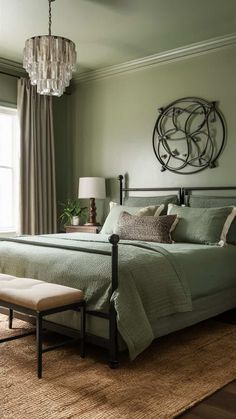 a bedroom with a large bed and chandelier in the corner, along with a bench