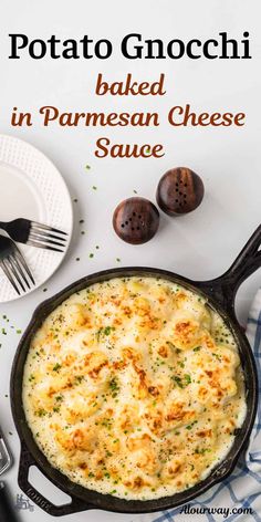 baked parmesan cheese sauce in a cast iron skillet on a white table