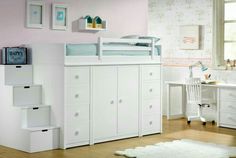 a child's bedroom with white furniture and pink walls