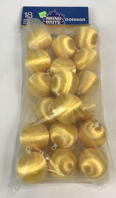 small gold donuts wrapped in plastic bag