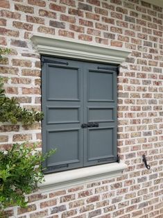 an open window on the side of a brick building