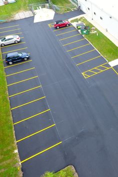 an empty parking lot with cars parked in it