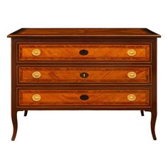 an antique chest of drawers with brass handles