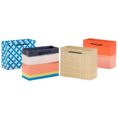 four different colored boxes with handles on each side and one has a blue, yellow, orange