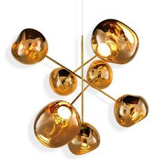 a gold colored chandelier hanging from a metal rod with five lights on each end