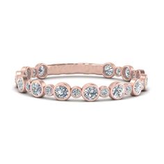 a rose gold band with round cut diamonds