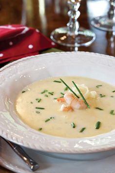 a white bowl filled with soup on top of a table