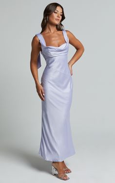 Get ready to turn heads in the stunning Cecilia Midi Dress - Cowl Neck Satin Bias Cut Dress In Iris Blue. The beautiful shade of blue is perfect for any occasion, whether it's a cocktail party or a formal event. Made from heavy-weight polyester, this slip dress drapes beautifully on your body, accentuating your curves and giving you an effortlessly elegant look. The cowl neck adds a touch of sophistication, while the midi length keeps things classy. With its timeless style and flattering silhoue Pastel Purple Formal Dress, Purple Silk Bridesmaid Dresses, Silk Pastel Bridesmaid Dresses, Classy Midi Dress Formal, Pastel Bridesmaid Dresses Satin, Senior Dinner Dance Dresses, Periwinkle Dress Bridesmaid, Personal Attendant Dresses, Satin Lavender Bridesmaid Dresses