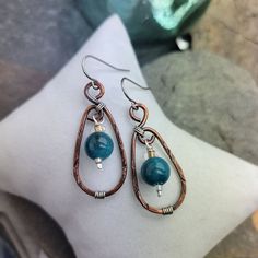 Stunning Blue Apatite Textured Copper Earrings, made with textured Copper and Silver Wire. The perfect addition to your jewelry collection! Great Energy These earrings are made with Beautiful Blue Apatite Gemstones, known for their striking blue color! Featuring a simple yet elegant design, these earrings are carefully hand crafted with copper and silver wire, textured and oxidized to give this unique look! They are lightweight and comfortable to wear all day long. You can effortlessly be styl Handmade Blue Apatite Earrings, Handmade Oval Apatite Jewelry, Jewelry Making Earrings, Gemstone Beads Jewelry, Oxidized Copper, Head Jewelry, Blue Apatite