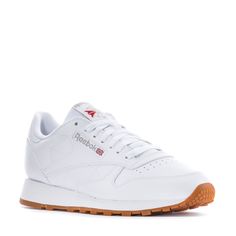 This Reebok Classic Leather with the gum sole is the most stylish and timeless sneaker to hit shelves. Featuring lightweight cushioning and a low-cut design, this casual men's sneaker is perfect for all-day wearing and versatile styling. Dress this sneaker up in slacks or dress them down with sweatpants and a fitted tee. Soft leather upper. Removable sockliner accommodates orthotics. Die-cut EVA midsole for lightweight cushioning. High abrasion rubber gum outsole for durability. Imported. Reebok Classic Leather, 5 Kids, Fitted Tee, Reebok Classic, Classic Leather, Cut Design, Workout Tee, Mens Bottom, Leather Men