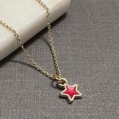 "A tiny enamel star charm hangs gently from a dainty gold vermeil chain...simple and elegant, perfect for layering. The star charm is available in red, yellow, white, light blue, dark blue, or light pink. The chain is 16\" with a 2\" extender. Very delicate and beautiful! 💙 If you prefer a magnetic clasp, check out the add-ons and upgrades section of our shop - it's available as an add-on to any bracelet and most necklaces, along with the option to upgrade your accent metal to solid 14k gold, y Star Gold Jewelry, Star-shaped Charm Necklaces For Gifts, Gold Star Charm Necklace Handmade, Handmade Gold Star Charm Necklaces, Handmade Gold Charm Necklaces With Star Shape, Handmade Gold Star Charm Necklace, Enamel Star Charm Jewelry, Red Necklace With Star Charm As Gift, Red Necklace With Star Charm For Gift