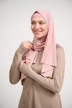 With its advanced sweat-wicking technology, the Aeroflex Sports Hijab Shawl ensures you stay fresh and focused throughout your workout or leisure activities. Crafted from a lightweight, stretchy fabric, it effortlessly adapts to your movements, providing a cooling sensation as you conquer your fitness goals. What sets this hijab shawl apart is its seamless design and glued hem, creating a sleek and polished look. No more distractions, just pure focus on your performance. Style it in any way that Versatile Lightweight Solid Activewear, Pink 4-way Stretch Activewear For Sports, Versatile Lightweight Activewear For Workout, Lightweight Solid Color Athleisure Activewear, Lightweight Solid Athleisure Activewear, Lightweight Athleisure Activewear, Versatile Lightweight Moisture-wicking Activewear, Lightweight Solid Activewear For Athleisure, Functional Pink Sweat-resistant Activewear