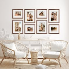 a living room with pictures on the wall and two chairs next to each other in front of a coffee table