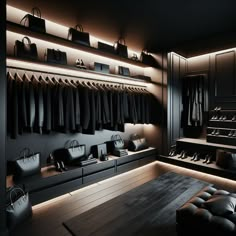 a room filled with lots of black bags and clothes hanging on the wall next to a bench