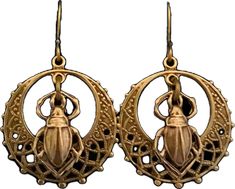 the earrings are gold and have a beetle on it's back droppers, with intricate filigrees