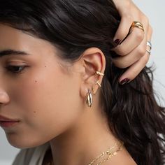 Bold adjustable Gold Ear Cuff that hugs around your upper lobe and conch. Sold as a single earring cuff. Gold Vermeil Hypoallergenic, lead and nickel free Thickness 3mm Inside Length 13mm (Does not fit those with large ear lobes) #E512-Gx1 Gold Ear Cuff, Single Earring, Cuff Earrings, Conch, Gold Vermeil, Ear Cuff, Cuff, Sterling Silver, Gold