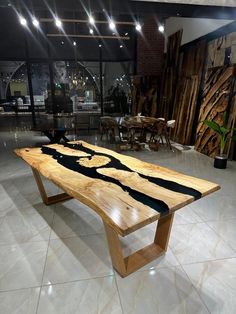 Custom Handmade Black Epoxy River Table - 240 x 105 cm (94.4 x 41.3 inches) Transform your space with our stunning handmade Black Epoxy River Table, crafted from premium ash wood. Each table is a one-of-a-kind piece, showcasing the unique beauty of the natural wood grain and the sleek, modern appeal of black epoxy resin. Product Details: Dimensions: 240 x 105 cm (94.4 x 41.3 inches) Material: High-quality ash wood with black epoxy resin Finish: Smooth, polished surface to highlight the intricate Resin Desk, Epoxy River Table, Resin Product, Wood Table Legs, Epoxy Table, River Table, Kitchen Dining Tables, Unique Beauty, Wood Patterns