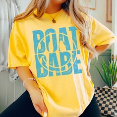 Hey there, Boat Babe! Are you ready to sail through life in style? Introducing our "Boat Babe" Comfort Color Tee – the perfect blend of nautical charm and laid-back comfort! Crafted from premium Comfort Color fabric, this tee feels as soft as a sea breeze against your skin. The playful "Boat Babe" graphic celebrates your love for all things maritime, whether you're out on the water or lounging on the shore. Whether you're setting sail on a yacht or simply daydreaming about your next seaside adve On A Yacht, Beach Bonfire, A Yacht, Comfort Colors Tee, Sea Breeze, Comfort Color, Color Fabric, Effortless Chic, Hey There