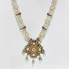 Weight: 194 Grams Center Pendant Dimensions: 110 mm x 83 mm  Necklace Length: 22 Inches Silver Part with adjustable thread  Stone: Fluorite and Kundan Hallmark: 925 The pendant is antique from the early 1900s and made with Barmeri craftsmanship in Rajasthan, it has been paired with 2 vintage payals/anklets on which Kundan work has been done.  Design unique to the world-famous Barmeri craftsmanship It comes with an adjustable thread called Chediya so that the length can be adjusted according to y Ornate Jeweled Necklaces For Festivals, Silver Jeweled Temple Necklace For Gifts, Ornate Green Jewelry For Festivals, Silver Jeweled Temple Necklace For Festivals, Traditional Green Jeweled Necklace, Traditional Gold Decorative Necklaces, Traditional Gold Necklace With Decorative Details, Traditional Silver Jeweled Temple Necklace, Ornate Silver Necklace With Meenakari