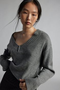 Forever staple BDG sweater in an effortless pullover sweater style. Designed in a boxy & cropped fit featuring a wide v-neckline and drop shoulders for a slouchy look. Finished with ribbed knit trim. Find it only at Urban Outfitters. Features BDG Jenna cropped v-neck sweater Slouchy oversized sweater Soft and stretchy knit Wide v-neckline and long sleeves with ribbed knit trim Ribbed knit hem Boxy, relaxed fit Cropped length Easy pullover style UO exclusive Contents + Care 53% Recycled polyester Star Headband, Slouchy Sweater, Leather Trench Coat, Shearling Coat, Velvet Tops, Pullover Jacket, V Neck Sweater, Her Style, Grey Sweater