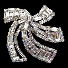 Clear Rhinestone Brooch, Huge and Exquisite, Clear and Bright Rhinestones, Top Quality Outstanding Artistic Bow Design! This is one of those rare, perfect clear rhinestone pieces of such high quality! Can't believe it's unsigned as it really hits me as a Vendome brooch. In my opinion, Vendome made the very best bow brooches. This definitely makes the grade! It's in minty vintage condition, all stones prong set in silver tone metal. This larger than usual brooch measures anywhere from 2 by 2 inch Crystal Rhinestone Brooches For Costume Jewelry, Crystal Rhinestone Brooches Costume Jewelry, Formal Crystal Brooches With Rhinestones, Formal Crystal Rhinestone Brooches, Crystal Brooches With Rhinestones For Anniversary, Glamorous Crystal Brooches For Formal Occasions, Formal Crystal Brooches With Sparkling Stones, Crystal Brooches With Sparkling Stones For Party, Party Brooches With Sparkling Crystal Stones