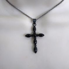 Beautiful in black obsidian and darkly oxidized 925 silver cross necklace! Five black onyx marquise stones at each end of the cross and a center round black onyx in an oxidized gothic style cross.. Marked 925 silver on the back of the cross. Your choice of chain in 16, 18 and 20 inches long. The cross is 1 7/8 inches long and 1 inch wide. Ships out by US Postal Service with insurance included in shipping fee in case of mail loss. Silver Cross Necklace, Black Obsidian, Gothic Style, Cross Pendant Necklace, Postal Service, Silver Cross, The Cross, Gothic Fashion, Black Onyx