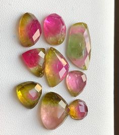 Embrace the trend with our Watermelon Tourmaline Rosecuts - a polished gemstone parcel boasting vibrant bi-color hues. Each gem exhibits great luster, creating dreamy pieces perfect for jewelry mounting. This beautiful collection features: Color: Watermelon Bicolour Weight: 41.65ct Dimensions: Averages of 12mm, 15mm, and 20mm Shapes: Various, adding uniqueness Origin: Afghanistan Unleash the potential of each piece in jewelry design, as these Afghan-origin gems bring a touch of elegance and trendiness to your creations. Multicolor Round Tourmaline Gemstones, Multicolor Tourmaline Natural Stones Gemstones, Multicolor Tourmaline Gemstones In Round Shape, Watermelon Sugar, Indicolite Tourmaline, Blue Tourmaline, Rocks And Gems, Watermelon Tourmaline, Neon Color