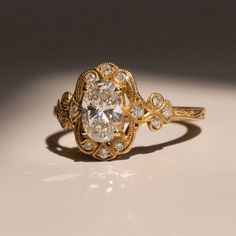 An undeniably beautiful ring inspired by the Victorian era.    Materials - 14k Yellow Gold, Lab-Grown Diamond (IGI Certified) Weights - 1.00ct lab grown Diamond, 0.14ct Melee Diamond Diamond Specs Cut - Oval Color - G Clarity - VS1 Dimensions - 8mm x 5mm x 3 Size - 6.5 Gold Oval Engagement Ring, Victorian Diamond Ring, Delicate Engagement Ring, New Victorian, Dream Wedding Ring, Victorian Engagement Rings, Victorian Ring, Cute Engagement Rings, Future Engagement Rings