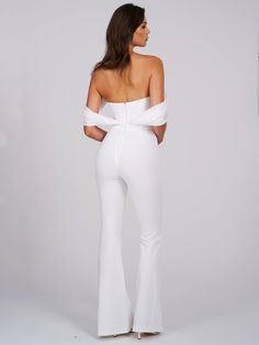 We wanted something soft, clean, and elegant so Sherlyn is what we created! Cut from a soft stretch crepe this fully lined jumpsuit is a must add to your summer white wardrobe. Featuring a boned corset bodice, silk pleated draping details, and a straight leg fit with a flared hem. This sleek jumpsuit channels iconic energy. Boned Corset Bodice Draping Shoulders Flared Leg Materials: Stretch Crepe / Silk Pleated / Boned Corset Length: Approx 52.3inch / 140cm lnside Seam Length of Trousers: Approx Fitted Jumpsuits And Rompers For Gala In Summer, Fitted Summer Jumpsuits And Rompers For Gala, Fitted Jumpsuits And Rompers For Summer Gala, Elegant Strapless Elastane Jumpsuit For Party, Formal Stretch Strapless Jumpsuit, Elegant Formal Jumpsuits And Rompers, Chic Strapless Stretch Jumpsuit For Formal Occasions, Chic Stretch Strapless Jumpsuit For Formal Occasions, Elegant Full-length Stretch Jumpsuits