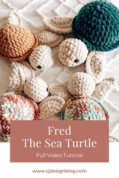 several crocheted turtle toys laid out on a white bed with the top one turned upside down