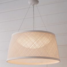 a white lamp hanging from the ceiling