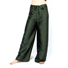 "These beautiful handmade lemongrass green silk wraparound pants from Thailand are so comfy and super soft. They can adjust to any size so great for plus size, just wrap and tie to your comfort level. Can be worn dressed up for wedding pants or for dressing casual. They tie in the front and back. See photos. Measurements- * Waist 22-54\"/ 56-137 cm * Inseam 28\"/ 71 cm Materials- 100% Thai Silk" Traditional Green Harem Pants, Traditional Green Harem Trousers, Traditional Green Straight Pants, Green Yoga Trousers, Loosely Fitted Green Harem Pants For Yoga, Green Harem Yoga Pants With Loosely Fitted Hips, Green Full Length Pants For Festival, Full Length Green Pants For Festival, Green Full-length Pants For Festivals