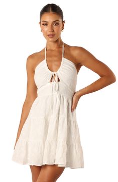 Tonal floral embroidery covers this tiered cotton minidress fixed with a halter neckline that makes it perfect for a sunny-weather look. Slips on over head Halter neck Lined 100% cotton Hand wash, dry flat Imported Spring Beach Tiered Dress With Tie Back, Sleeveless Tie Back Tiered Beach Dress, Sleeveless Tie Back Tiered Dress For Beach, Sleeveless Tiered Dress With Tie Back For Beach, Halter Neck Mini Dress With Tie Straps For Vacation, Cotton Tiered Summer Beach Dress, Beach Tiered Mini Dress With Tie Back, Tiered Mini Dress With Tie Back For Beach, Cotton Tiered Summer Dress For Vacation