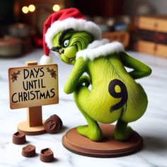 there is a grin face figurine next to a sign that says 9 days until christmas