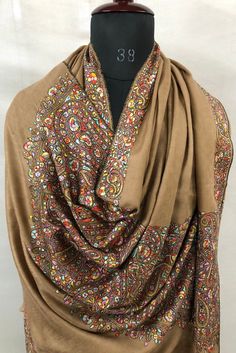 * * MATERIAL:- 100 percent Authentic Ladakhi Cashmere Pashmina used and HandWoven on Traditional Wooden Handloom in Kashmir. * * No Mixture of any other fibre like Viscose, Silk, etc. 100 % Pure Pashmina/Cashmere * * Weight :- 250 grams * * Colour:- Tobacco Brown * * Condition:- Brand New * * Feel:- Very Soft * * EMBROIDERY:- Very Fine Hand Embroidery of Kashmiri Traditional Needle Work. * * Embroidery done by Cotton Thread. * * Lifetime Guarantee for Authenticity and Handmade Nature of Shawls. Needle Work Embroidery, Soft Embroidery, Indian Handicrafts, Kashmiri Shawls, Cashmere Pashmina, Shawl Pins, Pashmina Shawl, Needle Work, Cashmere Wool