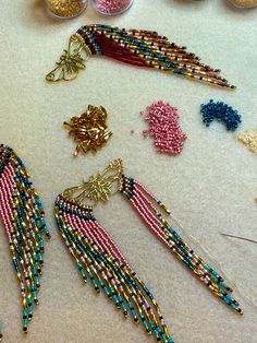 Long delicate multicolor fringe sways and dances just like a butterfly on the breeze. These beaded earrings are handmade and lightweight. Premium delica seed beads were hand sewn onto golden brass butterfly findings and hung from brass ear wires. Features 24k gold plated hex tubes for some extra pizazz. Your choice of peach or burgundy. We could also make these in custom colors. Just message us. 4.25 inches long1 5/8 inches wide These are arrive boxed and ready to gift- perfect for a nature love Butterfly Fringe, Brass Butterfly, Beads Craft Jewelry, Like A Butterfly, Beads Craft, Craft Jewelry, A Butterfly, Bead Crafts, Seed Bead