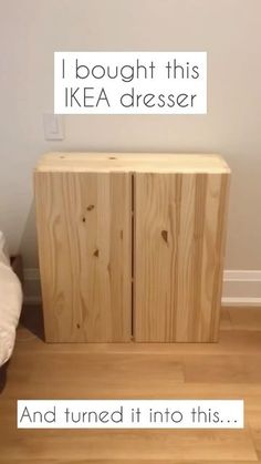 a wooden cabinet sitting on top of a hard wood floor next to a white wall