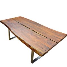 a wooden table with metal legs and a slab of wood on the top that has been cut in half