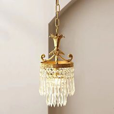 a gold chandelier hanging from the ceiling