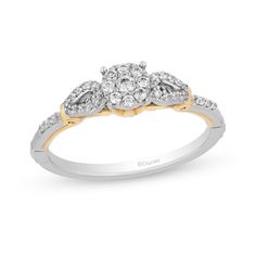 a white and yellow gold ring with three diamonds