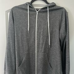 Never Worn Soft Hoodie Spring Sweatshirt With Adjustable Hood For Everyday, Everyday Spring Sweatshirt With Adjustable Hood, Gray Hoodie For Everyday Spring Wear, Spring Everyday Hoodie Sweatshirt, Everyday Spring Sweatshirt With Double-lined Hood, Casual Heather Grey Hoodie Outerwear, Casual Heather Grey Hoodie, Casual Heather Grey Outerwear With Ribbed Cuffs, Casual Hooded Jacket For Spring