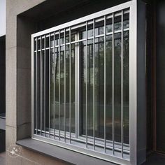 a window with bars on the side of it