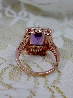 Natural Purple Amethyst Rose Gold plated Sterling Silver RingPicture Frame Design#D227 Inspired by Victorian era designs, this is a lovely reproduction ring. This lovely filigree handcrafted sterling silver ring is overlaid with rose gold plating. This flawless 5 carat Natural Purple Amethyst is 11mm x 9mm. The ring is 11/16" (17.5mm) North to South on the finger. The inside of the band is marked 925 for sterling silver. Notice the beautiful daisies on the outside of the setting and band. There Victorian Jewelry, Engraved Items, How To Make Notes, Amethyst Ring, Victorian Era, Purple Amethyst, Gold Plated Sterling Silver, Rose Gold Plates, Stone Color