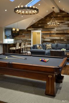 a pool table in the middle of a living room