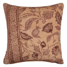 a brown and tan pillow with floral design on the front, sitting on a white background