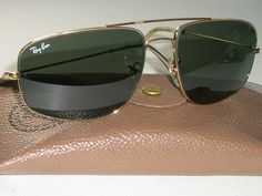 You are bidding on very gently/slightly/barely used, stunning looking pair of 1980's 58[]17mm VINTAGE B&L RAY BAN W0502 GEP ARISTA G15 UV SLEEK EXPLORER AVIATOR SUNGLASSES w/CASE. Please see pictures for further details & markings. Both lenses as well as nose pads are etched with small BL logo. LOOKS PRACTICALLY BRAND NEW...MINT G15 UV GLASS LENSES.  Distance b/w the hinges is 5 1/4", overall vertical height is 1 3/4" & length of temple arm is 5". Consolidated shipping is offered on multiple ite Ray Ban Frames, Sunglasses Mens, Gold Aviator Sunglasses, Fashion Eye Glasses, Aviator Sunglasses Mens, Mens Glasses, Eye Glasses, Aviator Sunglasses, Fashion Sunglasses