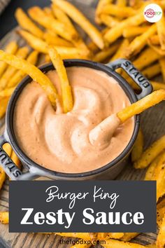 a plate with fries and dipping sauce on it