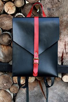 Black leather Backpack with red strap, Full Grain Leather Laptop, Leather Anniversary Gifts, Backpack Purse for Women ... This backpack is made of natural black leather with red leather closure strap. a small but noticeable accent. There is a pocket for small things inside. Simple but beautiful design for everyday use. EVERY BAG HAS BEEN HAND CRAFTED FROM THE FINEST GENUINE LEATHER GIVING EACH BAG ITS OWN INDIVIDUAL MARKINGS Each bag is sewn by hand without the use of a sewing machine. Which cre Red Rectangular Leather Backpack For School, Red Rectangular Leather Backpack For Everyday, Rectangular Red Leather Backpack For Everyday, Red Leather Backpack For Daily Use, Red Leather Backpack With Adjustable Strap For School, Red Leather Backpack With Adjustable Strap For Travel, Red Leather Travel Backpack With Adjustable Strap, Red Leather Backpack With Adjustable Strap For Everyday, Red Leather Backpack For Everyday